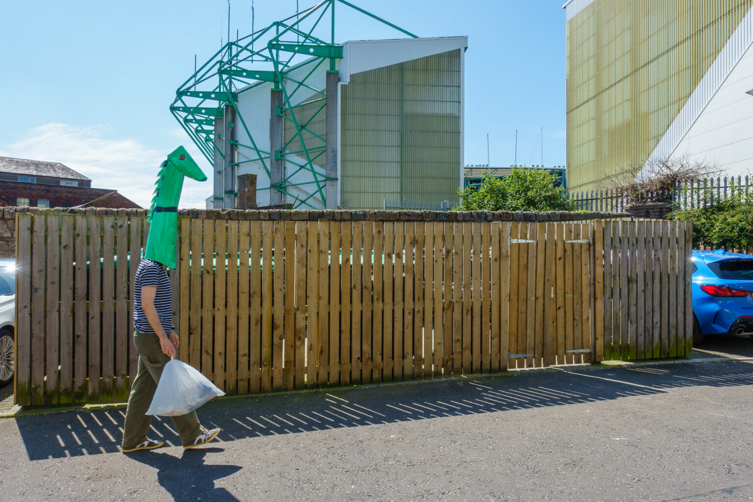 Wojtek, dressed as a monster, on the way to a rubbish bin