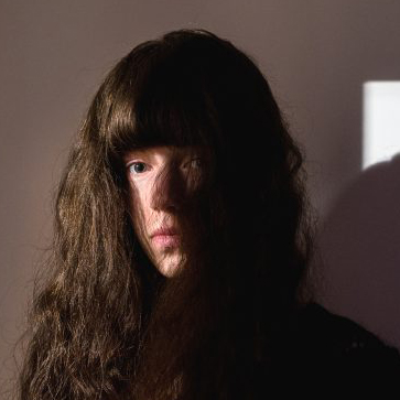 Portrait of a long-haired Anna Dust. A winning image in the Portrait of Britain 2015 competition