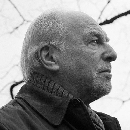 Side black and white portrait of John McLeod, Scottish composer.