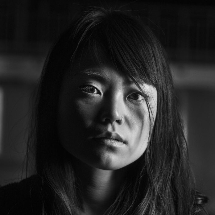 Portrait of Ryoko Tamura, Japanese-born Scottish illustrator. This image is in black and white.