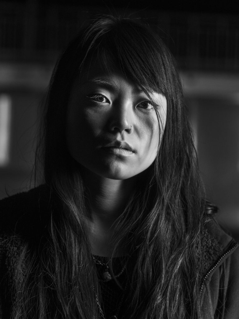 Portrait of Ryoko Tamura, Japanese-born Scottish illustrator. This image is in black and white.