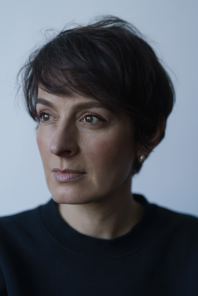 Sylwia photographed from half-profile, with a natural light.