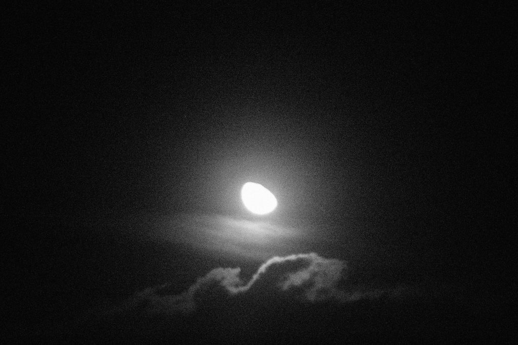 Photograph of a sinister, dark moon